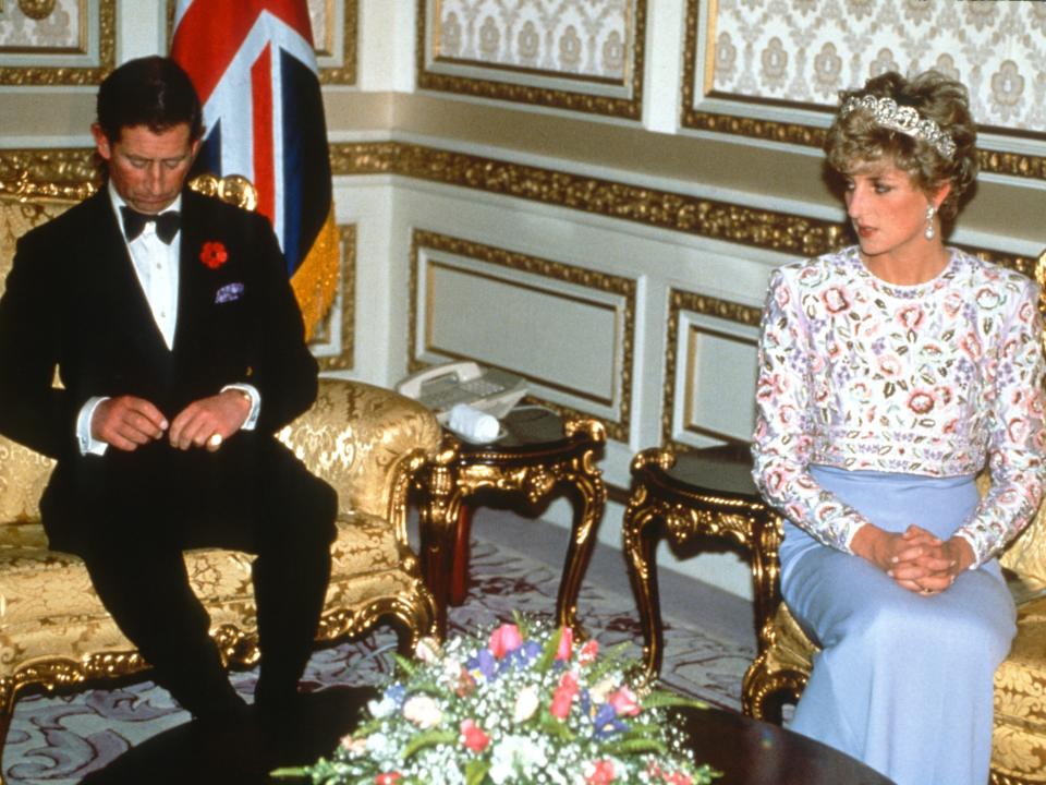 Prince Charles, Prince of Wales and Diana, Princess of Wales, wearing a mauve sheaf dress designed by Catherine Walker with a bolero of embroidered pastel flowers and the Spencer family tiara, attend a banquet thrown by President Roh Moo-hyun on November 3, 1992 in Seoul, South Korea.