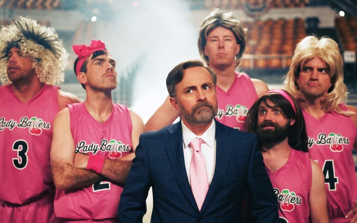 The movie was written and directed by Jeremy Boreing (centre), who also plays the coach of the fake transgender team