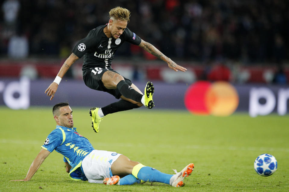 PSG's Neymar, top, is tackled by Napoli's Nikola Maksimovic during the Champions League, group C, soccer match between Paris Saint Germain and Napoli at the Parc des Princes stadium in Paris, Wednesday, Oct. 24, 2018. (AP Photo/Francois Mori)