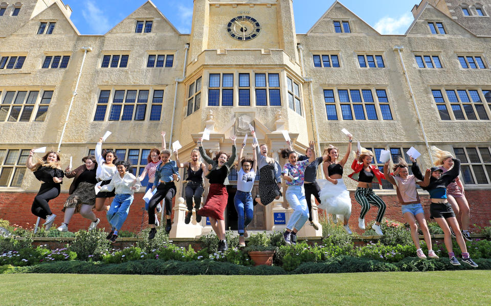 Students celebrate their A Level results from Roedean School in Brighton. (Photo by Gareth Fuller/PA Images via Getty Images)