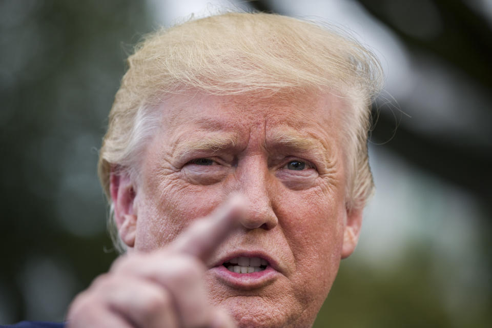 President Donald Trump speaks with reporters on the South Lawn of the White House before departing, Wednesday, July 17, 2019, in Washington. (AP Photo/Alex Brandon)