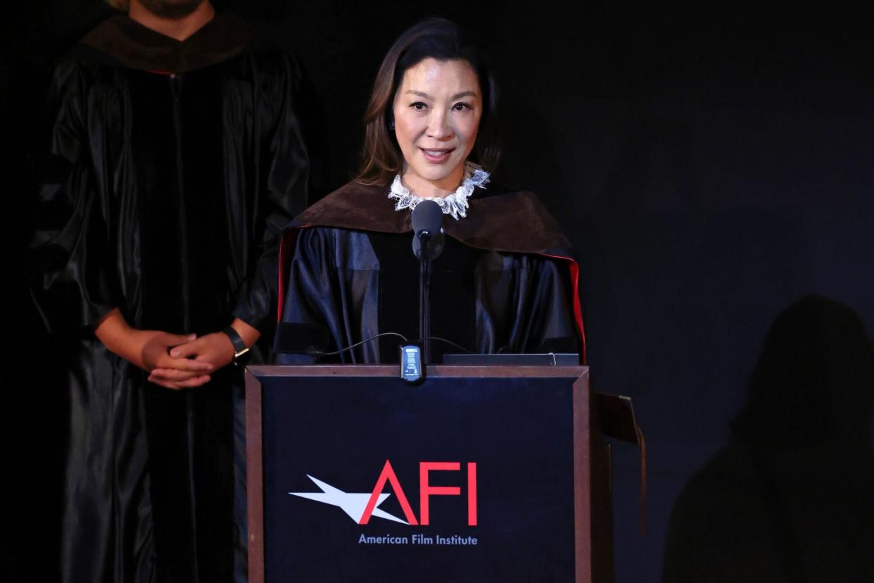 HOLLYWOOD, CALIFORNIA - AUGUST 13: Honorary Doctorate Recipient Michelle Yeoh speaks on stage at the AFI Conservatory class of 2022 commencement ceremony at TCL Chinese Theatre on August 13, 2022 in Hollywood, California. (Photo by David Livingston/Getty Images)