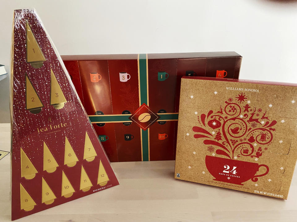 This image shows a variety of coffee and tea packages for advent calendar fans, including the Tea Forte has just launched their limited-edition advent tea calendar, left, and Williams Sonoma's 24 Days of Coffee package. (Katie Workman via AP)