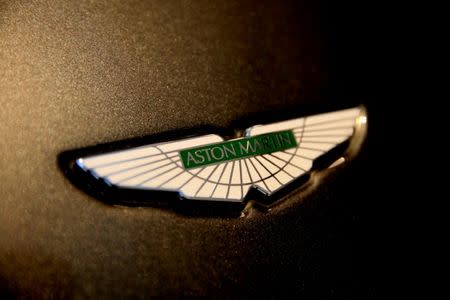 FILE PHOTO: FILE PHOTO: The Aston Martin logo on the front of a car at a dealership in Singapore June 1, 2017. REUTERS/Thomas White/File Photo