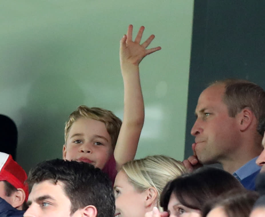 Prince George waving at Carrow Road as he watches with his father Prince William during the Premier League match between Norwich City and Aston Villa at Carrow Road on October 5, 2019 in Norwich, United Kingdom.