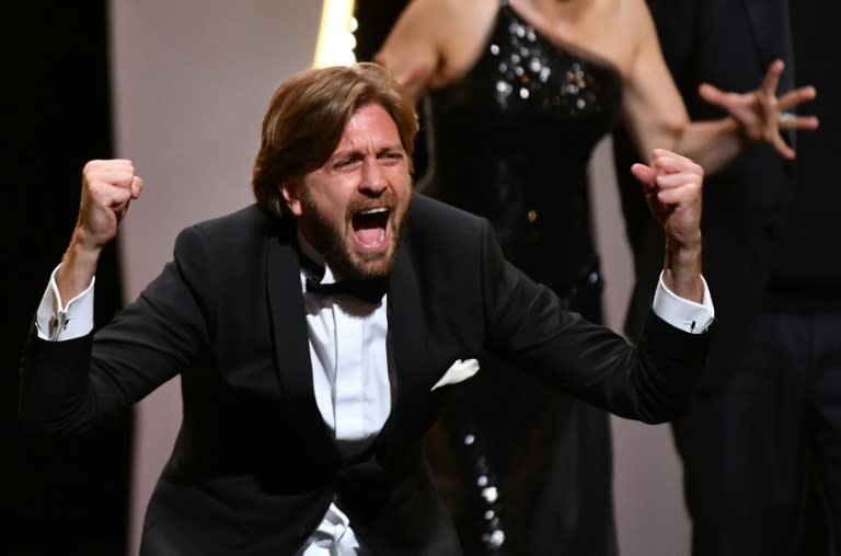 I have a scream: Swedish director Ruben Ostlund shows his delight after being honoured with the Palme d'Or for his satire 'The Square'