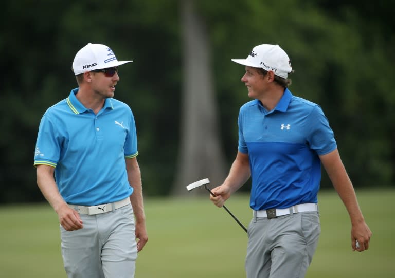 Jonas Blixt of Sweden and Cameron Smith of Australia react to their putt on the sixth green during the third round of the Zurich Classic, at TPC Louisiana in Avondale, on April 29, 2017