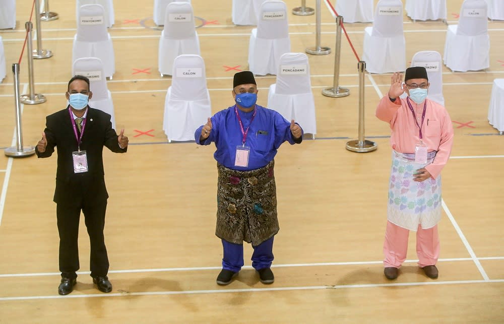 (From left) Independent candidate Santharasekaran Subramanian, Barisan Nasional’s Mohd Zaidi Aziz  and Pejuang’s Amir Khusyairi Mohamad Tanusi at the nomination centre in Tanjong Malim August 15, 2020. ― Picture by Farhan Najib