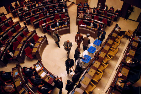 Members of the Kurdistan Region Parliament vote during a session in Erbil, Iraq February 18, 2019. REUTERS/Azad Lashkari