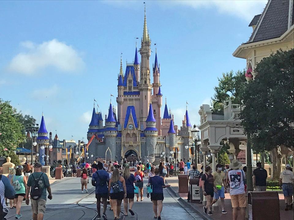 Disney annual passholders get a peek at the coronavirus-inspired changes inside the Magic Kingdom Thursday, July 9, 2020 in Lake Buena Vista, Fla. “The Most Magical Place on Earth” is reopening after nearly four months with new rules in place to help prevent the spread of coronavirus. Walt Disney World’s Magic Kingdom and Animal Kingdom are reopening Saturday, while Epcot and Disney’s Hollywood Studios will follow four days later. (Gabrielle Russon/Orlando Sentinel via AP)