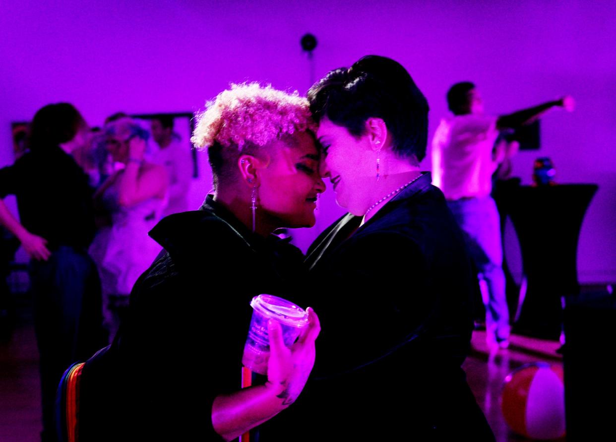 Echo Madkins, left, and Chloe Romano enjoy a dance during the Shreveport Q-Prom Saturday evening  June 24, 2023, at Artspace in downtown Shreveport. 