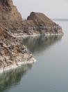 This April 22, 2016 photo shows the road along Jordan's shore of the Dead Sea, which is actually a spectacular lake 1,400 feet (400 meters) below sea level with one of the highest levels of salinity in the world. This Middle Eastern country delivers a blockbuster list of iconic ancient monuments, otherworldly landscapes and warmhearted hospitality, with Petra as its tourism jewel. (Giovanna Dell'Orto via AP)