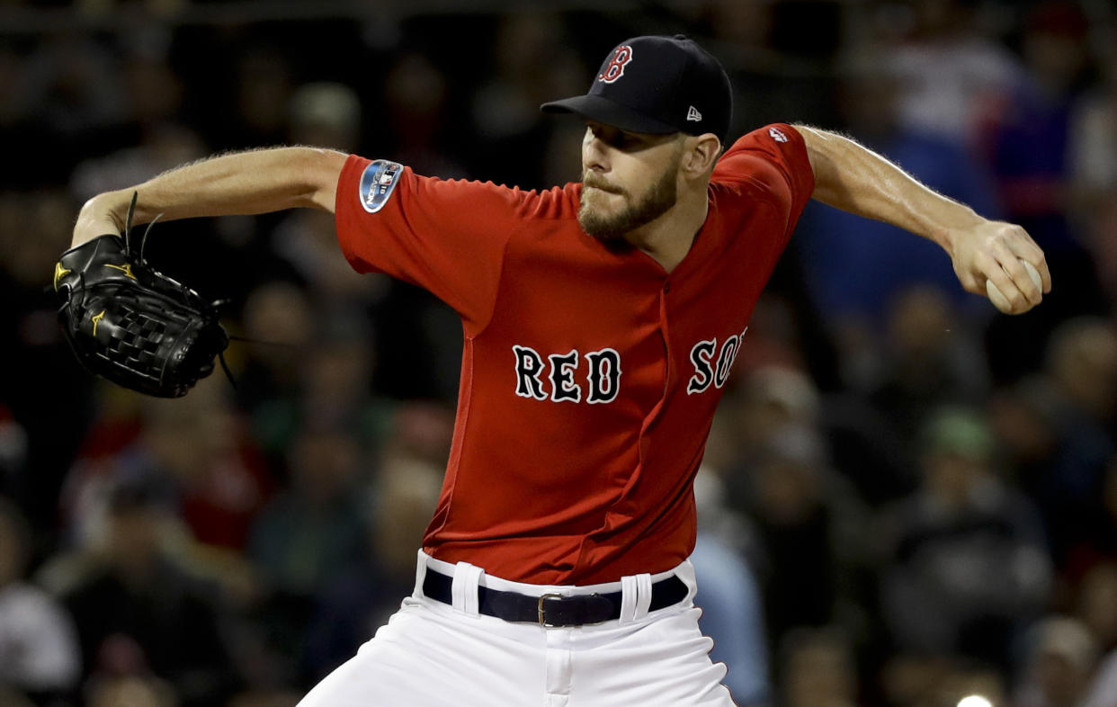 Boston Red Sox starting pitcher Chris Sale throws against the Houston Astros during the first inning in Game 1 of a baseball American League Championship Series on Saturday, Oct. 13, 2018, in Boston. (AP Photo/David J. Phillip)