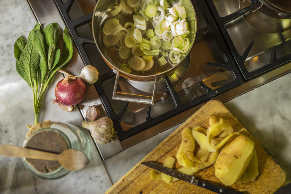 Preparing soup with leeks and potatoes.