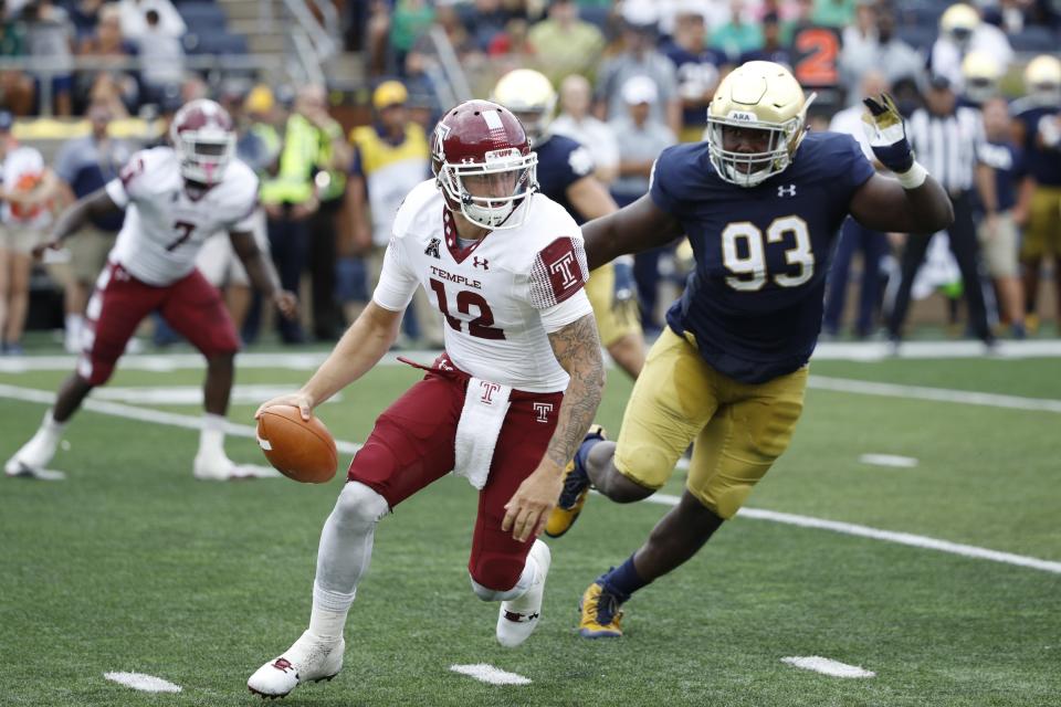 SOUTH BEND, IN – SEPTEMBER 02: Logan Marchi #12 of the Temple Owls tries to evade pressure from Jay Hayes #93 of the Notre Dame Fighting Irish in the third quarter of a game at Notre Dame Stadium on September 2, 2017 in South Bend, Indiana. The Irish won 49-16. (Photo by Joe Robbins/Getty Images)