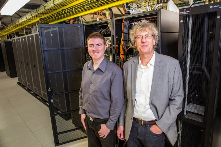 University of Canterbury alumni composer Jason Long (L) and professor Jack Copeland pose for a photo in Christchurch, on September 6, 2016