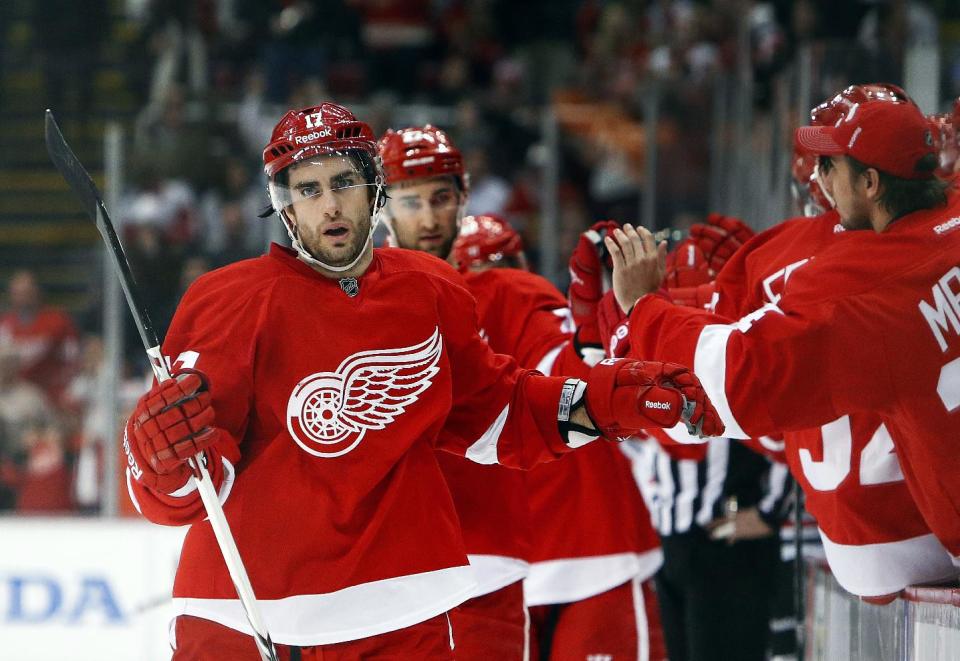 Detroit Red Wings wing Patrick Eaves celebrates a goal against Chicago Blackhawks goalie Corey Crawford in the first period of an NHL hockey game Wednesday, Jan. 22, 2014, in Detroit. (AP Photo/Paul Sancya)
