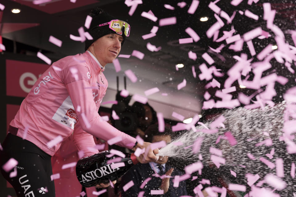 Tadej Pogacar celebrates retaining the pink jersey of leader of the race after the 17th stage of the Giro d'Italia from Selva di Val Gardena to Passo Brocon, Italy, Wednesday, May 22, 2024. (Marco Alpozzi/LaPresse via AP)