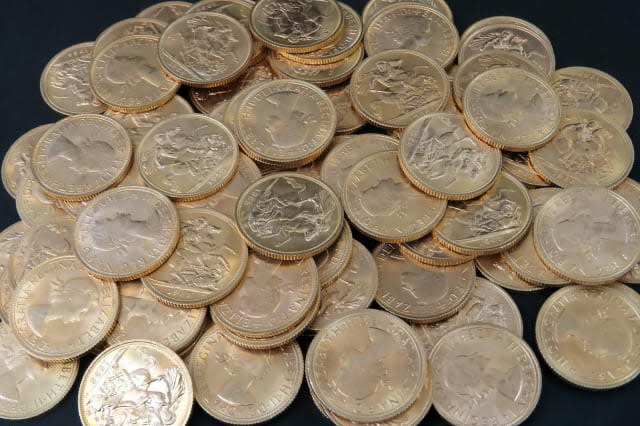 An auctioneer was stunned when he carried out a routine house clearance and found a hoard of gold and silver worth over Â£35,000 stashed in a SUITCASE.  See NTI story NTICOINS.  Jonathan Humbert was told the elderly woman had "a few gold coins" but found a suitcase weighing over 40kg (88lbs) behind a sofa filled with treasures.  The lady, who did not wish to be named, said a "close relative" invested in the treasures and left them to her when they passed away.  But the stash, which was amassed over a decade ago in Towcester, Northants., has since quadrupled in value.  There were over a hundred 22-carat gold sovereigns, which cost Â£200 each, and 17 solid silver bars weighing 1kg (2lbs) that are each worth Â£450.  Mr Humbert found several kilos of coins - including 22-carat gold Krugerrand that fetch up to Â£1,200 per ounce - as well as solid silver, half-silver and 22-carat gold British coins.  It took staff at JP Humbert Auctioneers an entire day to sort out the trove on January 25 before it went for auction on Tuesday (31/1).