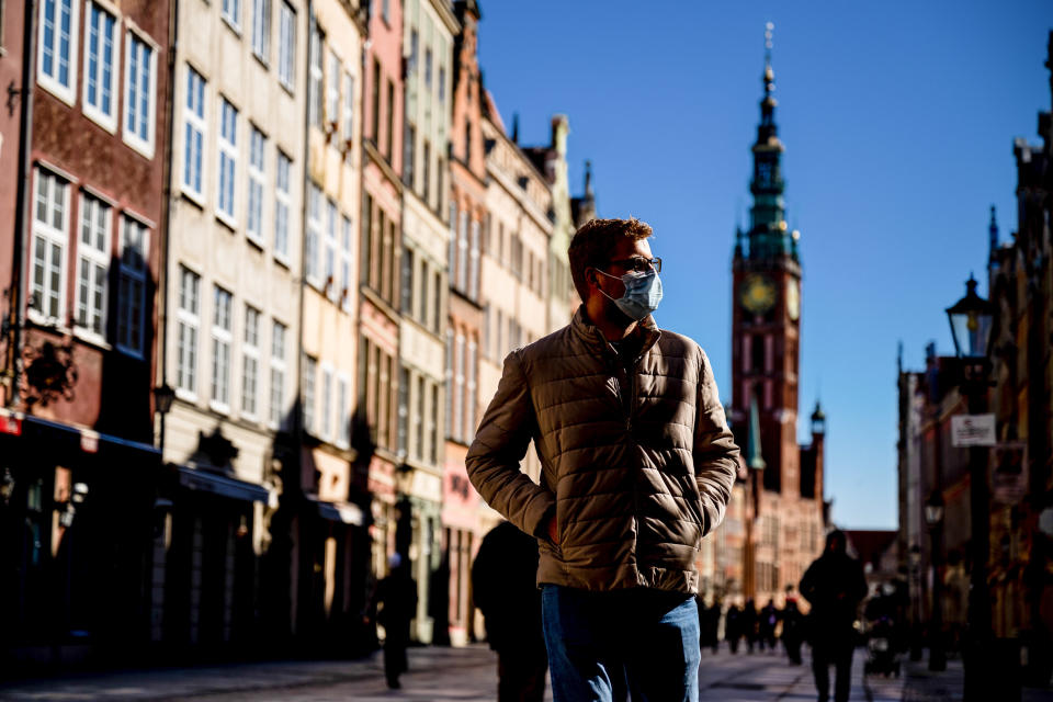 GDANSK, POLAND - 2021/03/22: A man wearing a mask as a preventive measure against the spread of covid-19 walks along the main Street in the old town of Gdansk.
By the decision of the government, from March 20 to April 9, new restrictions will be introduced related to the coronavirus pandemic in Poland. This means that the new restrictions will apply during Easter. The daily average of infections in Poland in the last seven days amounted to over 22,200 cases. (Photo by Mateusz Slodkowski/SOPA Images/LightRocket via Getty Images)