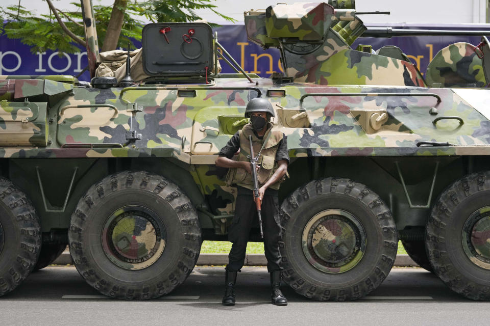 A Sri Lankan army soldier stands guard on a street in Colombo, Sri Lanka, Saturday, May 14, 2022. Protesters attacked earlier this week by supporters of Sri Lanka’s government are demanding that the newly appointed prime minister arrest his predecessor for allegedly instigating the attack against them as they called for his resignation. (AP Photo/Eranga Jayawardena)