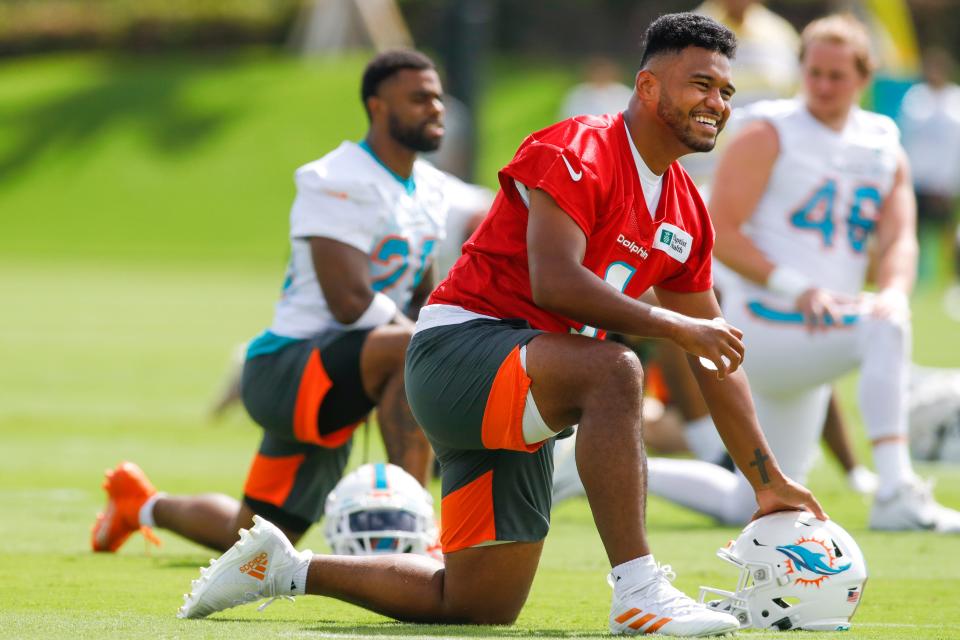 Dolphins quarterback Tua Tagovailoa flashes a smile while working out during minicamp at Baptist Health Training Complex in Miami Gardens, Florida.