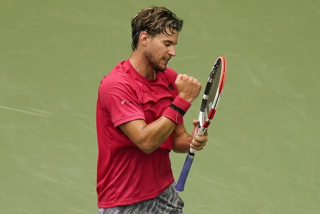 Dominic Thiem punches his racket in frustration