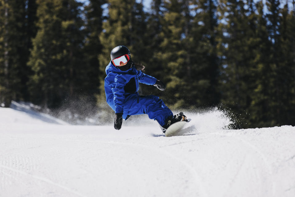 Patti Zhou, 11, snowboards at Copper Mountain, Colo., April 8, 2022. The Beijing-born, Colorado-living Zhou could be the next big thing in the halfpipe and slopestyle, including this weekend during her Dew Tour debut in Copper Mountain, Colorado. (Jesse Dawson/Burton Snowboards via AP)