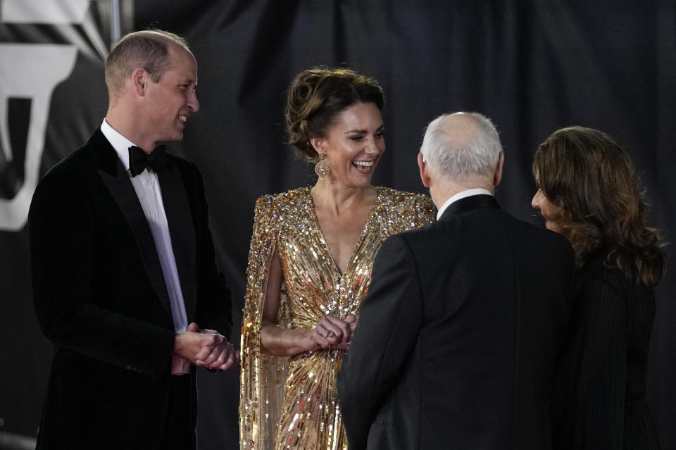 Britain's Prince William, from left, and his wife Kate the Duchess of Cambridge speak with Michael G. Wilson and Barbara Broccoli upon arrival for the World premiere of the new film from the James Bond franchise 'No Time To Die', in London Tuesday, Sept. 28, 2021. (AP Photo/Matt Dunham)