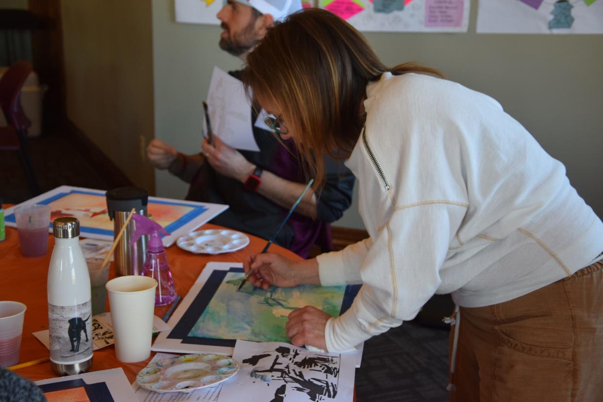 Lisa Penberthy-Keene, Ottawa Elementary School art teacher, works on her watercolor painting during a workshop hosted by Crooked Tree Arts Center on April 15, 2024.