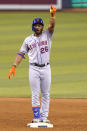 New York Mets' Khalil Lee gestures after hitting a double to score Dominic Smith during the 12th inning of the team's baseball game against the Miami Marlins, Friday, May 21, 2021, in Miami. The Mets won 6-5 in 12 innings. (AP Photo/Lynne Sladky)