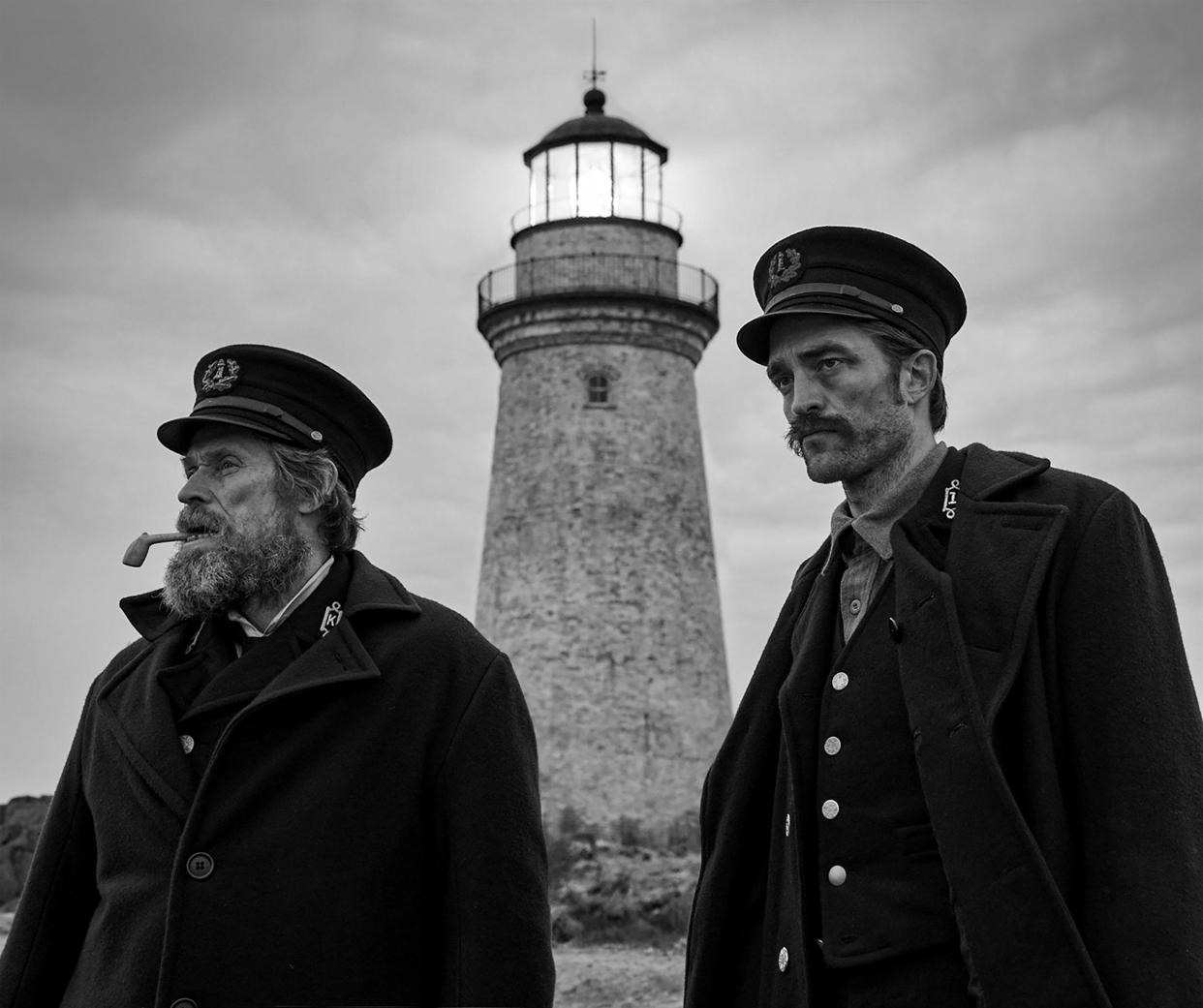 Willem Dafoe (left) and Robert Pattinson star as lighthouse keepers on a remote New England island who begin to lose their sanity in "The Lighthouse."