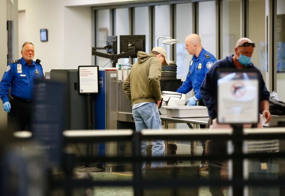 Travelers make their way through a TSA checkpoint at the Springfield-Branson National Airport in this 2022 file photo.