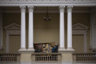 Workers move the Annunciation to the Blessed Virgin of the Bohorodchany Iconostasis in the Andrey Sheptytsky National Museum as part of safety preparations in the event of an attack in the western Ukrainian city of Lviv, Friday, March 4, 2022. The doors of the museum have been closed since Russia’s war on Ukraine began on Feb. 24, and heritage sites across the country face danger as the fighting continues. (AP Photo/Bernat Armangue)