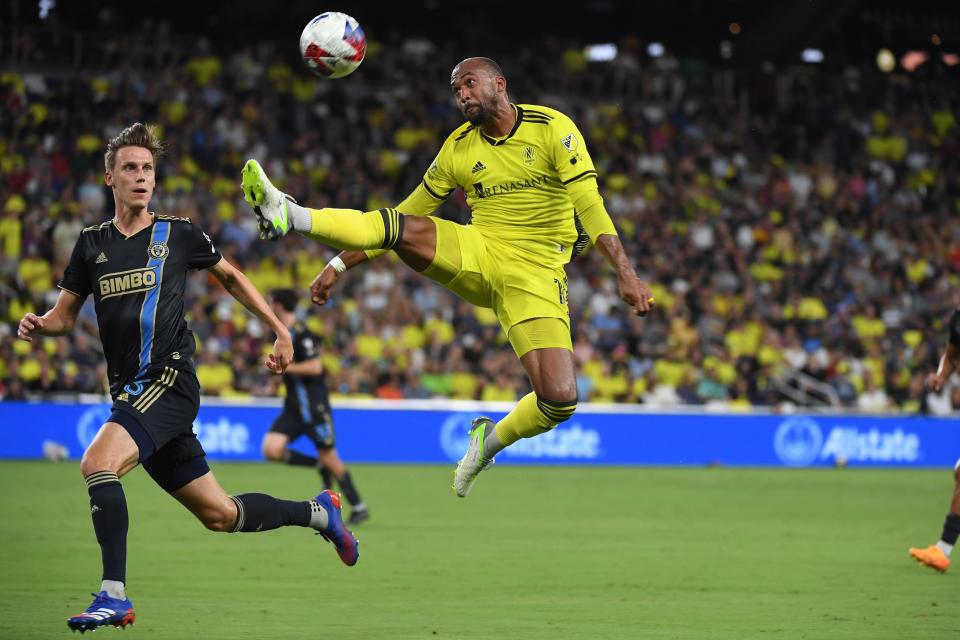 Jul 12, 2023; Nashville, Tennessee, USA; Nashville SC forward Teal Bunbury (12) attempts to control the ball defended by Philadelphia Union defender Jack Elliott (3) in the first half at Geodis Park.