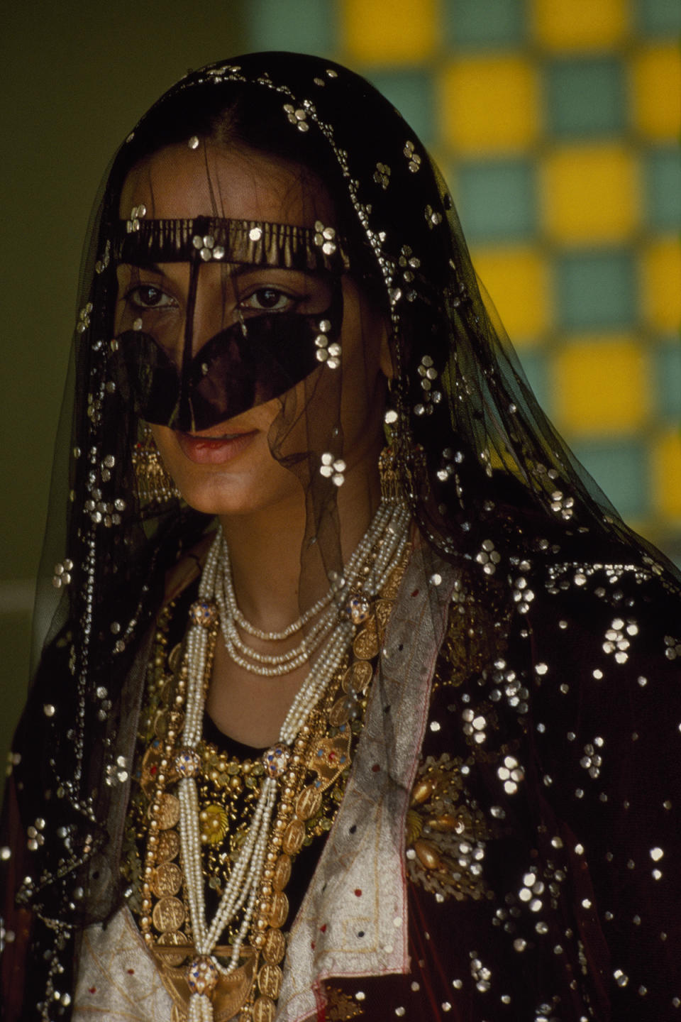 Veiled woman in harem. United Arab Emirates. Abu
Dhabi. 1970. 