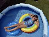 Amyia Garcia, 7, cools off in her backyard pool at her home in Springfield, Mass. (Don Treeger/The Republican via AP)