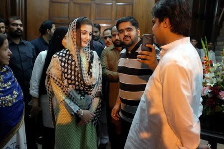 Maryam Nawaz, the daughter of Pakistan's former Prime Minister Nawaz Sharif, takes a picture with a supporter at a rally in Lahore, Pakstan September 9, 2017. Picture taken September 9, 2017. REUTERS/Drazen Jorgic