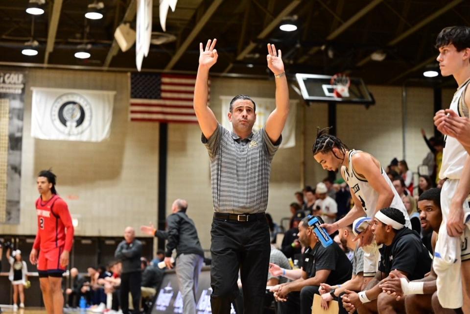 Bryant coach Jared Grasso on the sideline Friday night at the Chace Center.