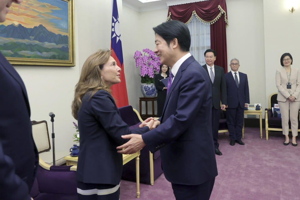 In this photo released by the Taiwan Presidential Office, Lisa McClain, left, secretary-general of the Republican Caucus of the U.S. House of Representatives meets with Taiwan President-elect and Vice President Lai Ching-te in Taipei, Taiwan on Tuesday, April 23, 2024. McClain and Democratic Congressman Dan Kildee jointly led a cross-party group of lawmakers to visit Taiwan from April 23 to 25 . Members also include Mark Alford, a member of the House Armed Services Committee. (Taiwan Presidential Office via AP)