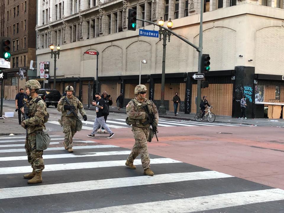 National Guardsmen patrol downtown Los Angeles on Sunday morning.