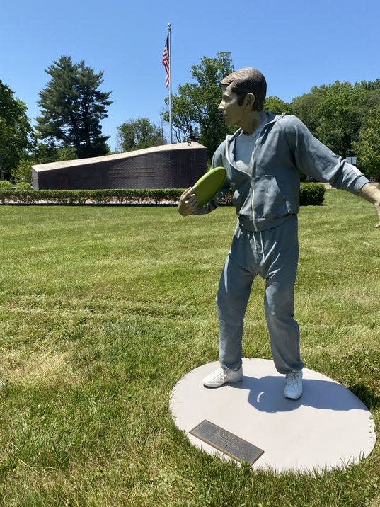 "Time Out," for some Frisbee? This sculpture is on display with the companion sculpture of the boy reading books at Veterans Square off Edgewood Road in Lower Makefield.