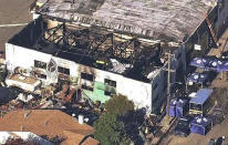 FILE - This Dec. 3, 2016 file image from video provided by KGO-TV shows the Ghost Ship Warehouse after a fire swept through the Oakland, Calif., building. A Northern California district attorney has told a judge she will no longer consider plea deals for two men charged in a 2016 warehouse fire that killed 36 people attending an unlicensed concert. The Associated Press obtained a copy of the letter Thursday, Aug. 16, 2018, a day before the two men are scheduled to return to court. (KGO-TV via AP, File)