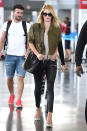 <p>The actress and supermodel definitely knows a thing or two about dressing for the airport. She arrived to LAX in a cropped military jacket and skintight black leather trousers.</p>