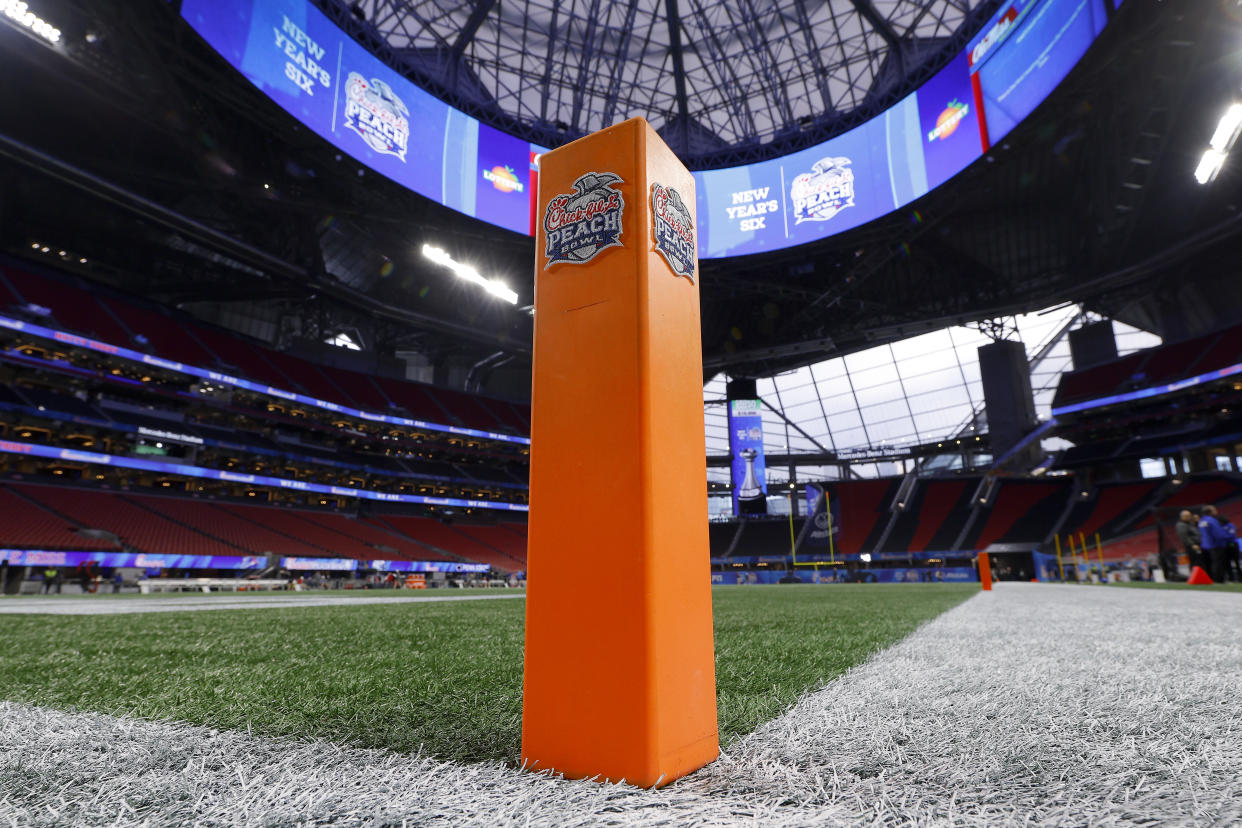 ATLANTA, GEORGIA - DECEMBER 30: A general view of the football field and signage before the Chick-fil-A Peach Bowl at Mercedes-Benz Stadium on December 30, 2023 in Atlanta, Georgia. (Photo by Todd Kirkland/Getty Images)
