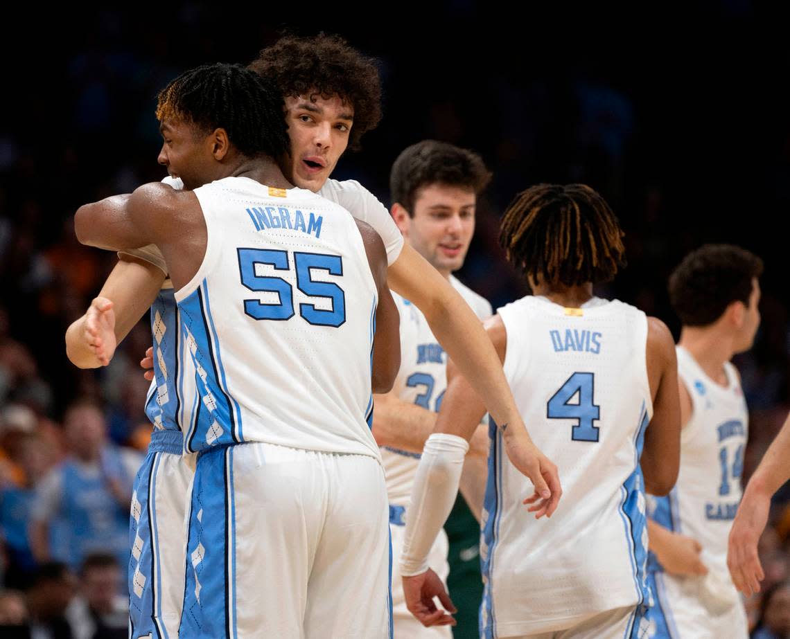 North Carolina’s Harrison Ingram (55) embraces Zayden High (1) as he comes of the game in the closing minutes of play against Michigan State on Saturday, March 23, 2024, during the second round of the NCAA Tournament at Spectrum Center in Charlotte, N.C. Ingram scored 17 points in the victory.