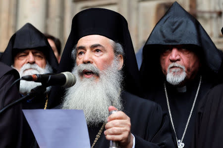 Greek Orthodox Patriarch of Jerusalem, Theophilos III, speaks during a news conference with other church leaders in front of the closed doors of the Church of the Holy Sepulchre in Jerusalem's Old City, February 25, 2018. REUTERS/Amir Cohen