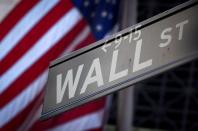 FILE PHOTO: A Wall Street sign outside the New York Stock Exchange