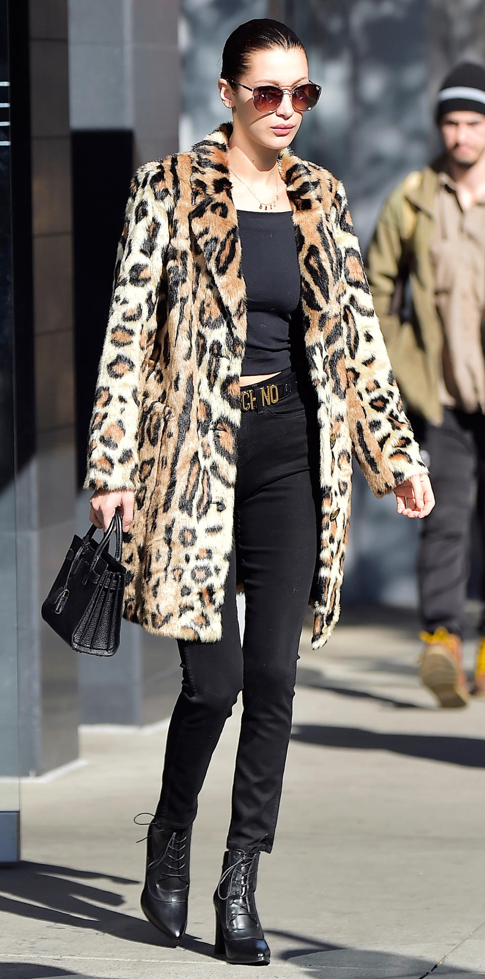 <p>While out in New York City, Hadid rocked a wild leopard print coat over tight black separates. She accessorized with a matching bag and heeled boots.</p>