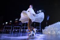 <p>South Korean figure skater Kim Yu-na performs during the opening ceremony of the Pyeongchang 2018 Winter Olympic Games at the Pyeongchang Stadium on February 9, 2018. / AFP PHOTO / POOL / FRANCK FIFE </p>